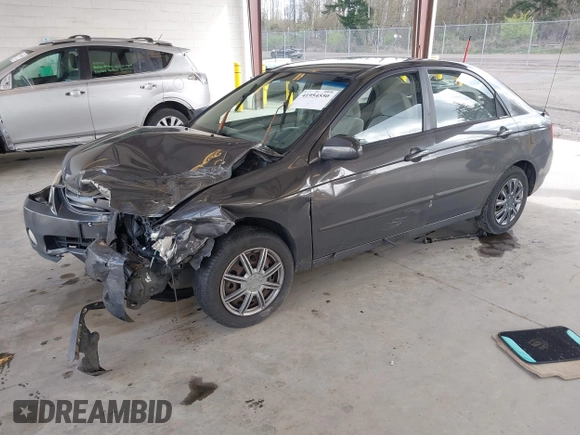 2004 Kia Spectra LX with VIN KNAFE121145031237, listed as a IAAI auction lot 41954550 with 133,744 mi miles. Bid and sale history available at carsss.com. Image 2.