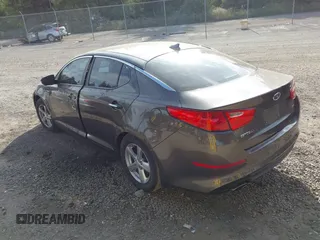 2015 Kia Optima LX with VIN 5XXGM4A77FG353705, listed as a IAAI auction lot 42519873 with 126,066 mi miles and . Bid and sale history available at DreamBid. Image 3.