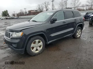 2012 Jeep Grand Cherokee Laredo with VIN 1C4RJFAG4CC173798, listed as a Copart auction lot 51758165 with 216,437 mi miles and Clean Title. Bid and sale history available at carsss.com. Image 1.