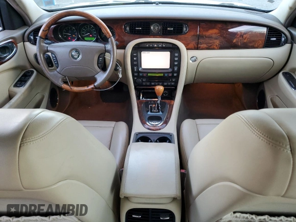 2005 Jaguar XJ with VIN SAJWA79C55SG37981, listed as a Copart auction lot 81142484 with 128,601 mi miles and Salvage Title. Bid and sale history available at carsss.com. Image 8.