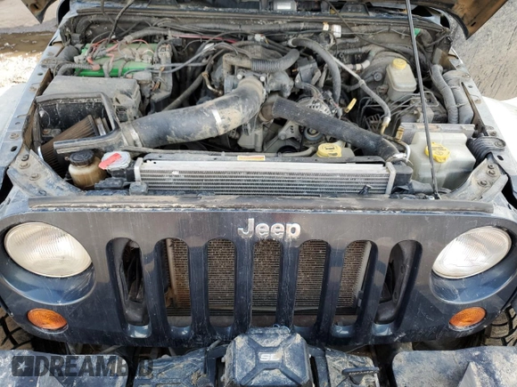 2007 Jeep Wrangler Unlimited Rubicon with VIN 1J4GA69177L100903, listed as a Copart auction lot 81321154 with 130,632 mi miles and Salvage title. Bid and sale history available at DreamBid. Image 12.