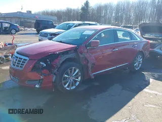 2014 Cadillac XTS Luxury z VIN 2G61N5S34E9163874, wystawiony jako IAAI lot #41649292 z przebiegiem 104 638 mil mil oraz . Historia ofert i sprzedaży dostępna na DreamBid. Obrazek 2.