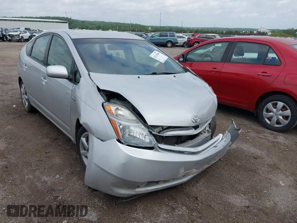 2007 Toyota Prius z VIN JTDKB20U873273942, wystawiony jako IAAI lot #42113046 z przebiegiem 126 635 mil mil oraz . Historia ofert i sprzedaży dostępna na DreamBid. Obrazek 1.