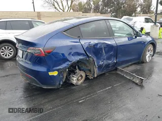 2022 Tesla Model Y Long Range with VIN 7SAYGDEE7NF409294, listed as a IAAI auction lot 41845261 with 73,116 mi miles and . Bid and sale history available at DreamBid. Image 4.