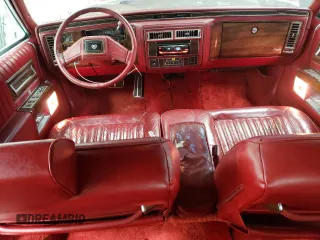 1988 Cadillac Brougham z VIN 1G6DW51Y2JR766782, wystawiony jako Copart lot #83797924 z przebiegiem 63 601 mil mil oraz Szkody całkowita. Historia ofert i sprzedaży dostępna na DreamBid. Obrazek 8.