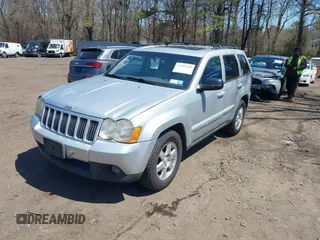2010 Jeep Grand Cherokee Laredo with VIN 1J4PR4GKXAC141526, listed as a IAAI auction lot 41997559 with 0 mi miles. Bid and sale history available at carsss.com. Image 2.