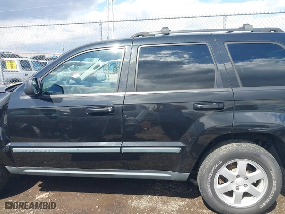 2009 Jeep Grand Cherokee Laredo with VIN 1J8GR48K99C550822, listed as a IAAI auction lot 41868508 with 179,436 mi miles. Bid and sale history available at carsss.com. Image 15.