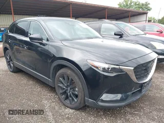 2023 Mazda CX-9 Touring Plus with VIN JM3TCBAY2P0657825, listed as a IAAI auction lot 42756562 with 52,090 mi miles and . Bid and sale history available at DreamBid. Image 1.