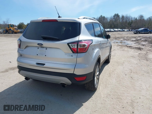 2017 Ford Escape Titanium with VIN 1FMCU9JD3HUE03686, listed as a IAAI auction lot 42016950 with 82,299 mi miles. Bid and sale history available at carsss.com. Image 4.