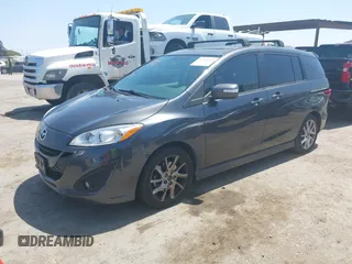 2014 Mazda 5 Grand Touring with VIN JM1CW2DL8E0171095, listed as a IAAI auction lot 41962650 with 85,048 mi miles and . Bid and sale history available at DreamBid. Image 2.