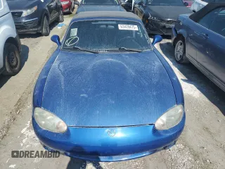 1999 Mazda MX-5 Miata with VIN JM1NB353XX0134898, listed as a Copart auction lot 63429475 with 140,595 mi miles and Clean title. Bid and sale history available at DreamBid. Image 5.