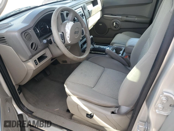 2009 Jeep Commander Sport with VIN 1J8HH48K59C514861, listed as a Copart auction lot 44076015 with 129,674 mi miles and Salvage title. Bid and sale history available at DreamBid. Image 7.