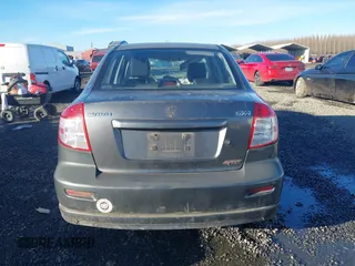 2010 Suzuki SX4 with VIN JS2YC5A40A6300053, listed as a IAAI auction lot 41392061 with 114,863 mi miles and . Bid and sale history available at DreamBid. Image 16.