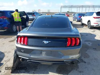 2020 Ford Mustang EcoBoost with VIN 1FA6P8TH3L5169920, listed as a IAAI auction lot 42339107 with 84,748 mi miles and . Bid and sale history available at DreamBid. Image 16.