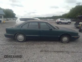 1998 Oldsmobile 88 LS z VIN 1G3HN52K5W4849011, wystawiony jako IAAI lot #42153650 z przebiegiem 171 969 mil mil oraz . Historia ofert i sprzedaży dostępna na DreamBid. Obrazek 13.