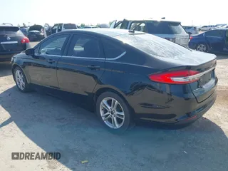 2018 Ford Fusion SE z VIN 3FA6P0H74JR125761, wystawiony jako IAAI lot #41992708 z przebiegiem 102 242 mil mil oraz . Historia ofert i sprzedaży dostępna na DreamBid. Obrazek 3.