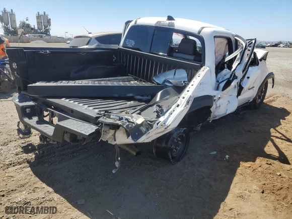 2023 Toyota Tacoma 4WD SR with VIN 3TMCZ5AN4PM541165, listed as a Copart auction lot 68909564 with 43,074 mi miles and Salvage Title. Bid and sale history available at carsss.com. Image 3.