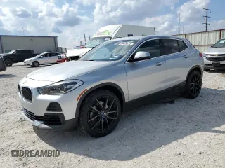2021 BMW X2 sDrive28i with VIN WBXYH9C04M5S06770, listed as a Copart auction lot 69489874 with 27,076 mi miles and Salvage Title. Bid and sale history available at carsss.com. Image 1.