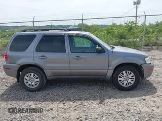 2007 Mercury Mariner Luxury z VIN 4M2CU91157KJ09026, wystawiony jako IAAI lot #42312495 z przebiegiem 156 572 mil mil oraz . Historia ofert i sprzedaży dostępna na DreamBid. Obrazek 13.