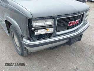 1999 GMC Yukon with VIN 1GKEK13R0XJ803237, listed as a IAAI auction lot 41736117 with 295,793 mi miles. Bid and sale history available at carsss.com. Image 6.