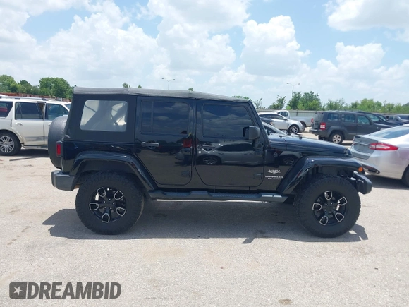 2015 Jeep Wrangler Unlimited Sahara with VIN 1C4HJWEG6FL572674, listed as a IAAI auction lot 42736266 with 97,024 mi miles and . Bid and sale history available at DreamBid. Image 13.