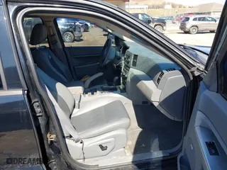 2007 Jeep Grand Cherokee Laredo with VIN 1J8GR48K67C523705, listed as a IAAI auction lot 41774281 with 215,572 mi miles. Bid and sale history available at carsss.com. Image 5.