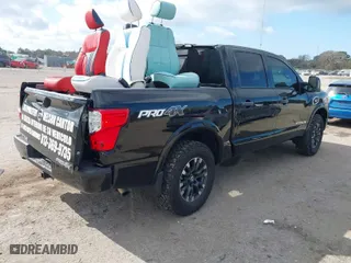 2017 Nissan Titan SV with VIN 1N6AA1E5XHN554086, listed as a IAAI auction lot 41463382 with 112,916 mi miles. Bid and sale history available at carsss.com. Image 4.
