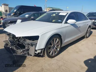 2014 Audi A8 3.0T z VIN WAURGAFDXEN006902, wystawiony jako IAAI lot #41099662 z przebiegiem 118 734 mil mil oraz . Historia ofert i sprzedaży dostępna na DreamBid. Obrazek 2.