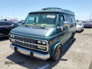 1994 Chevrolet Chevy Van z VIN 1GBEG25K9RF176079, wystawiony jako Copart lot #65824634 z przebiegiem 180 507 mil mil oraz Tytuł czysty. Historia ofert i sprzedaży dostępna na DreamBid. Obrazek 1.