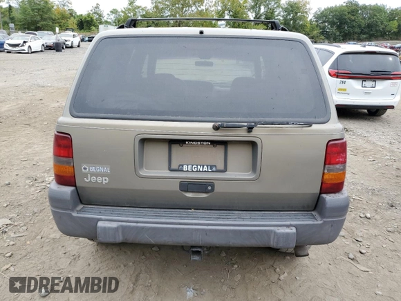 1996 Jeep Grand Cherokee Laredo with VIN 1J4GZ58S7TC403946, listed as a Copart auction lot 71785734 with 231,780 mi miles and Salvage Title. Bid and sale history available at carsss.com. Image 6.