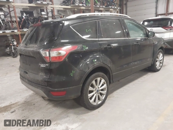 2017 Ford Escape Titanium with VIN 1FMCU9J9XHUB51401, listed as a IAAI auction lot 41025642 with 77,908 mi miles. Bid and sale history available at carsss.com. Image 4.