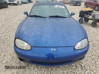 1999 Mazda MX-5 Miata with VIN JM1NB3532X0134801, listed as a Copart auction lot 83838374 with 97,015 mi miles and Salvage title. Bid and sale history available at DreamBid. Image 5.