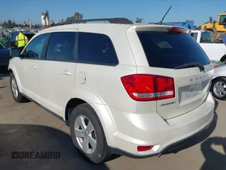 2012 Dodge Journey SXT z VIN 3C4PDCBG7CT374496, wystawiony jako IAAI lot #42317000 z przebiegiem 149 029 mil mil oraz . Historia ofert i sprzedaży dostępna na DreamBid. Obrazek 3.