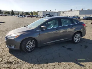 2015 Ford Focus Titanium с VIN 1FADP3J20FL322228, выставлен на аукционе Copart как лот 52038495 с пробегом 84 671 миль миль и Списание • Salvage title. История ставок и продаж доступна на DreamBid. Изображение 1.