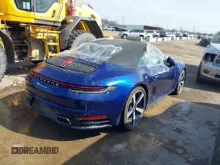2022 Porsche 911 Carrera with VIN WP0CA2A96NS236957, listed as a IAAI auction lot 41154002 with 34,056 mi miles and . Bid and sale history available at DreamBid. Image 4.