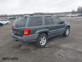 2002 Jeep Grand Cherokee Laredo with VIN 1J4GW48NX2C151430, listed as a IAAI auction lot 41886769 with 222,795 mi miles. Bid and sale history available at carsss.com. Image 4.