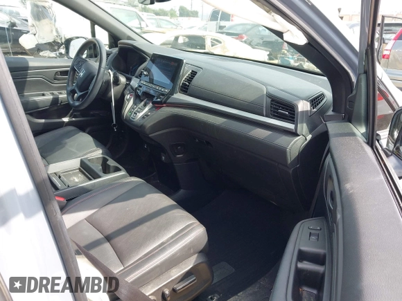 2023 Honda Odyssey Sport z VIN 5FNRL6H72PB031975, wystawiony jako IAAI lot #42047457 z przebiegiem 34 886 mil mil oraz . Historia ofert i sprzedaży dostępna na DreamBid. Obrazek 5.