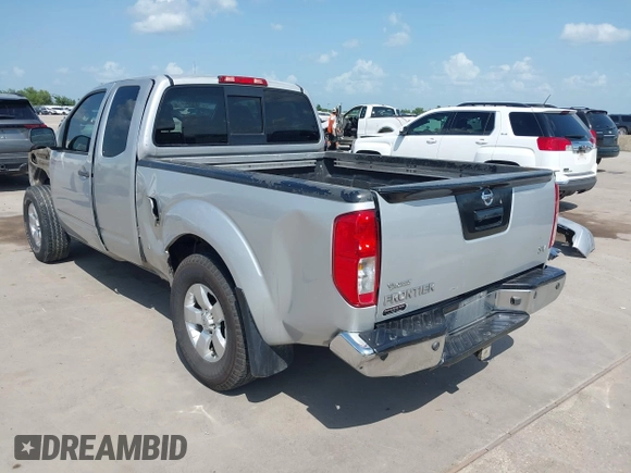 2013 Nissan Frontier SV with VIN 1N6AD0CUXDN763835, listed as a IAAI auction lot 42519926 with 208,577 mi miles and . Bid and sale history available at DreamBid. Image 3.