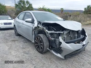 2019 Toyota Corolla L with VIN 5YFBURHE3KP932672, listed as a IAAI auction lot 41167472 with 104,974 mi miles and . Bid and sale history available at DreamBid. Image 1.