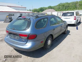1999 Ford Taurus SE with VIN 1FAFP58SXXA242975, listed as a IAAI auction lot 42253538 with 228,824 mi miles and . Bid and sale history available at DreamBid. Image 4.