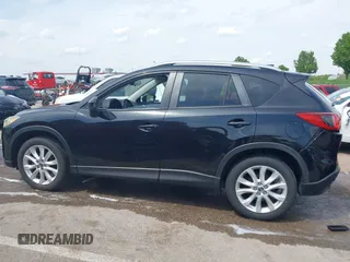 2013 Mazda CX-5 Grand Touring with VIN JM3KE4DE6D0148030, listed as a IAAI auction lot 42082947 with 119,432 mi miles and . Bid and sale history available at DreamBid. Image 14.