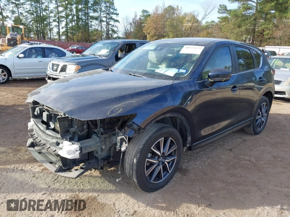 2018 Mazda CX-5 Touring z VIN JM3KFACM0J1389057, wystawiony jako IAAI lot #40922679 z przebiegiem 140 026 mil mil oraz . Historia ofert i sprzedaży dostępna na DreamBid. Obrazek 18.