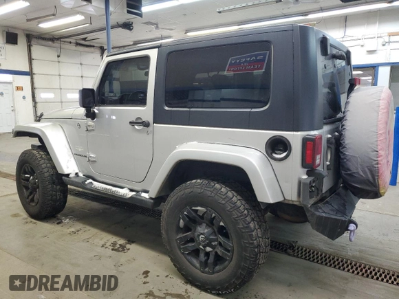 2010 Jeep Wrangler Sahara z VIN 1J4GA5D17AL109979, wystawiony jako Copart lot #45081225 z przebiegiem 190 826 mil mil oraz Szkoda całkowita • Salvage title. Historia ofert i sprzedaży dostępna na DreamBid. Obrazek 2.