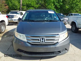 2011 Honda Odyssey EX-L with VIN 5FNRL5H6XBB073482, listed as a IAAI auction lot 42090463 with 213,061 mi miles and . Bid and sale history available at carsss.com. Image 12.