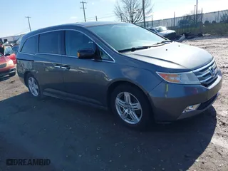2013 Honda Odyssey Touring with VIN 5FNRL5H97DB018839, listed as a IAAI auction lot 41884016 with 171,650 mi miles. Bid and sale history available at carsss.com. Image 1.