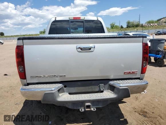 2012 GMC Canyon SLT z VIN 1GTH6NFE7C8115301, wystawiony jako Copart lot #58160785 z przebiegiem 154 682 mil mil oraz Szkoda całkowita • Salvage title. Historia ofert i sprzedaży dostępna na DreamBid. Obrazek 6.
