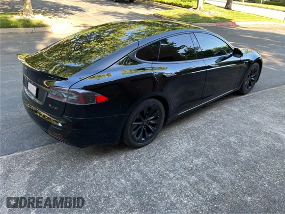 2017 Tesla Model S 60 with VIN 5YJSA1E15HF219286, listed as a Copart auction lot 57360515 with 44,520 mi miles and Salvage title. Bid and sale history available at DreamBid. Image 4.