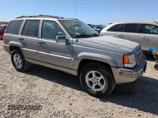 1998 Jeep Grand Cherokee Limited z VIN 1J4GZ88Z8WC306919, wystawiony jako Copart lot #61505725 z przebiegiem 195 329 mil mil oraz Czysty tytuł • Clean title. Historia ofert i sprzedaży dostępna na DreamBid. Obrazek 4.