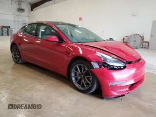 2022 Tesla Model 3 Long Range with VIN 5YJ3E1EBXNF285779, listed as a Copart auction lot 54630135 with 129,097 mi miles and Clean Title. Bid and sale history available at DreamBid. Image 4.