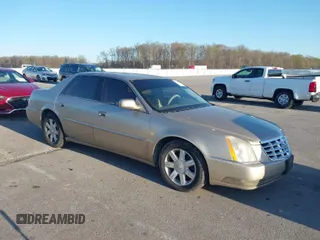 2006 Cadillac DTS w/1SC with VIN 1G6KD57Y06U105695, listed as a IAAI auction lot 41955066 with 134,913 mi miles. Bid and sale history available at carsss.com. Image 1.